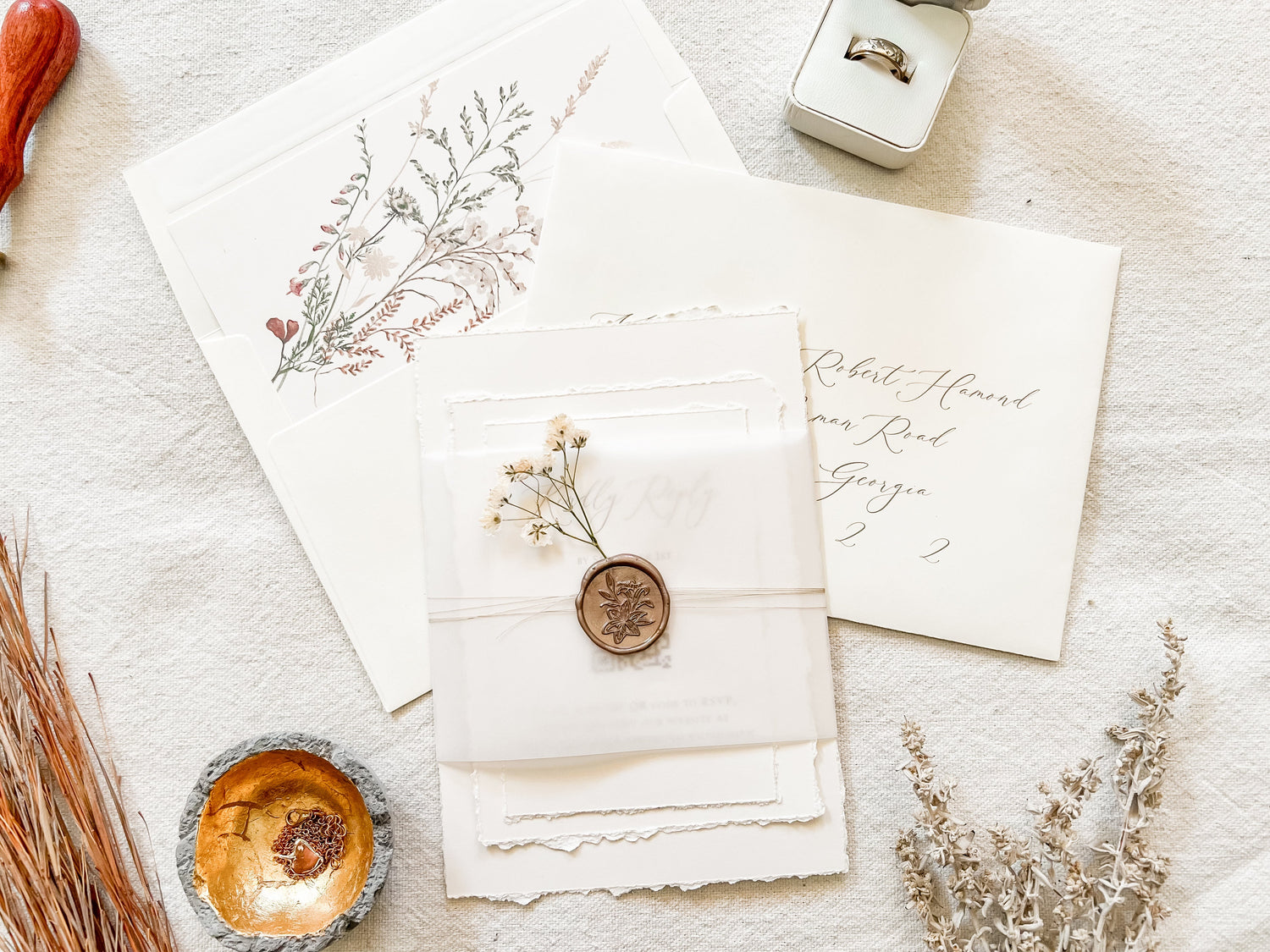 baby's breath wedding invitation with wax seal and vellum