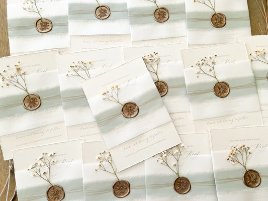 Muted Sage Green Wedding Invitation with Deckled Edging, Vellum Belly Band, Chiffon Ribbon, Dried Baby’s Breath and Wax Seal