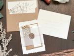 Elegant Ivory Baby’s Breath Wedding Invitation with Deckled Edging, Vellum Belly Band and Wax Seal