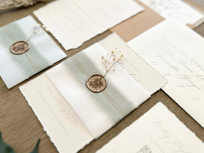 Muted Sage Green Wedding Invitation with Deckled Edging, Vellum Belly Band, Chiffon Ribbon, Dried Baby’s Breath and Wax Seal