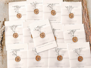 Contemporary Ivory Wedding Invitation with Baby’s Breath, Deckled Edging, Vellum Belly Band and Wax Seal