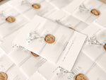 Contemporary Ivory Wedding Invitation with Baby’s Breath, Deckled Edging, Vellum Belly Band and Wax Seal