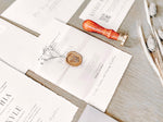 Contemporary Ivory Wedding Invitation with Baby’s Breath, Deckled Edging, Vellum Belly Band and Wax Seal