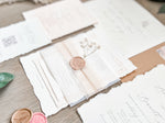 Neutral Wedding Invitation with Deckled Edging, Vellum Belly Band, Chiffon Ribbon, Dried Baby’s Breath and Wax Seal