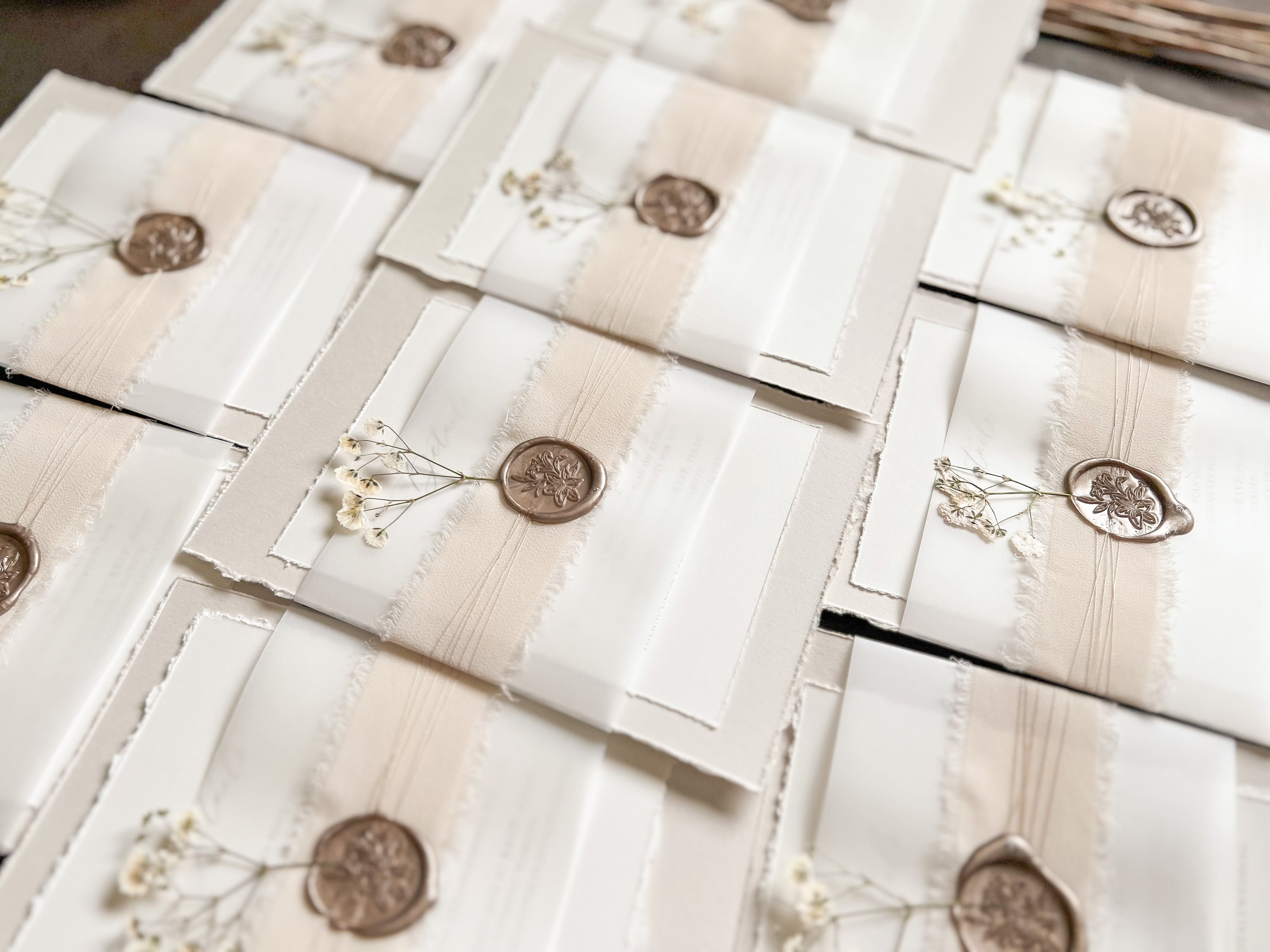 Neutral Wedding Invitation with Deckled Edging, Vellum Belly Band, Chiffon Ribbon, Dried Baby’s Breath and Wax Seal