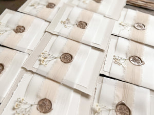 Neutral Wedding Invitation with Deckled Edging, Vellum Belly Band, Chiffon Ribbon, Dried Baby’s Breath and Wax Seal