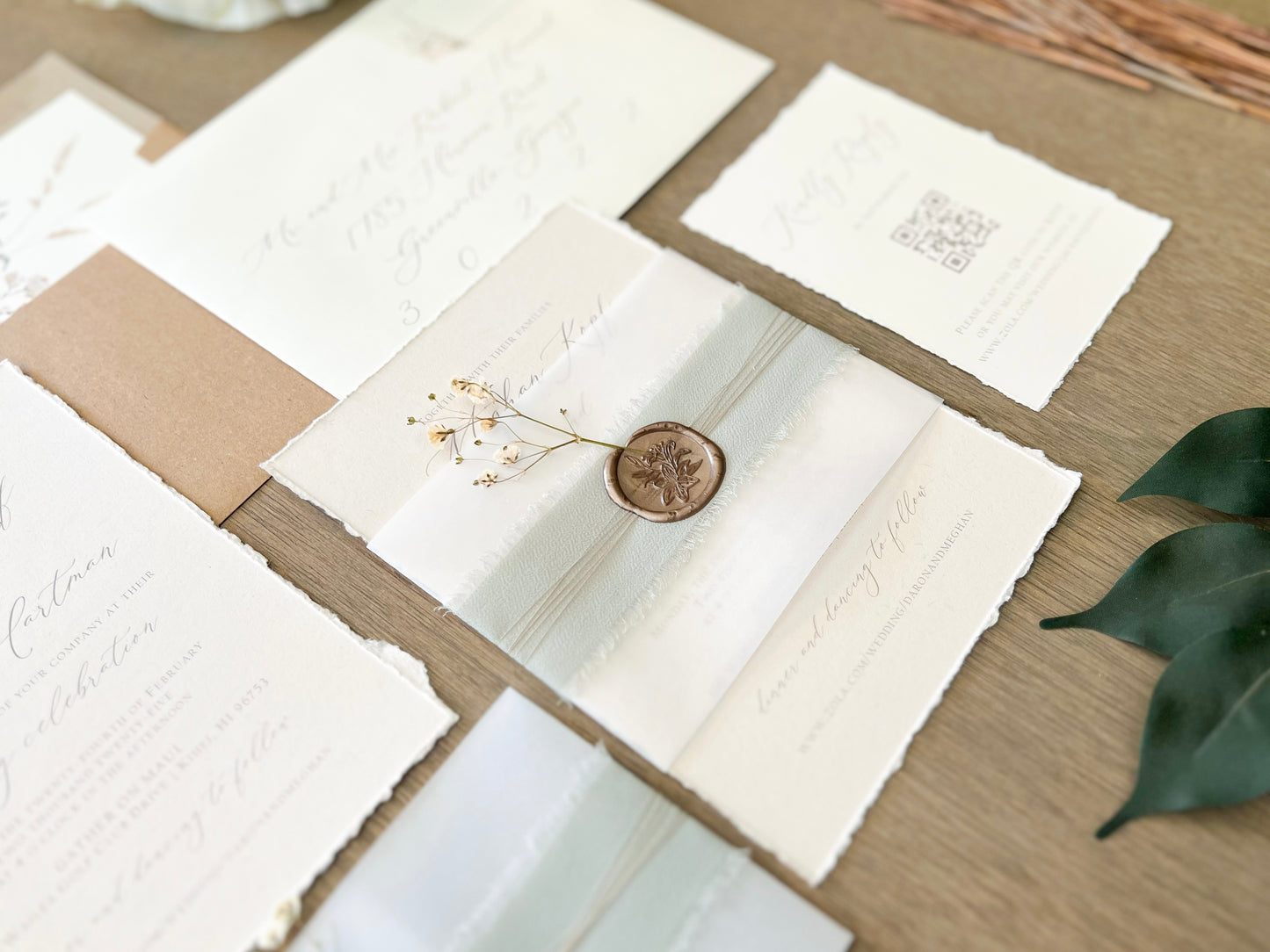 Muted Sage Green Wedding Invitation with Deckled Edging, Vellum Belly Band, Chiffon Ribbon, Dried Baby’s Breath and Wax Seal