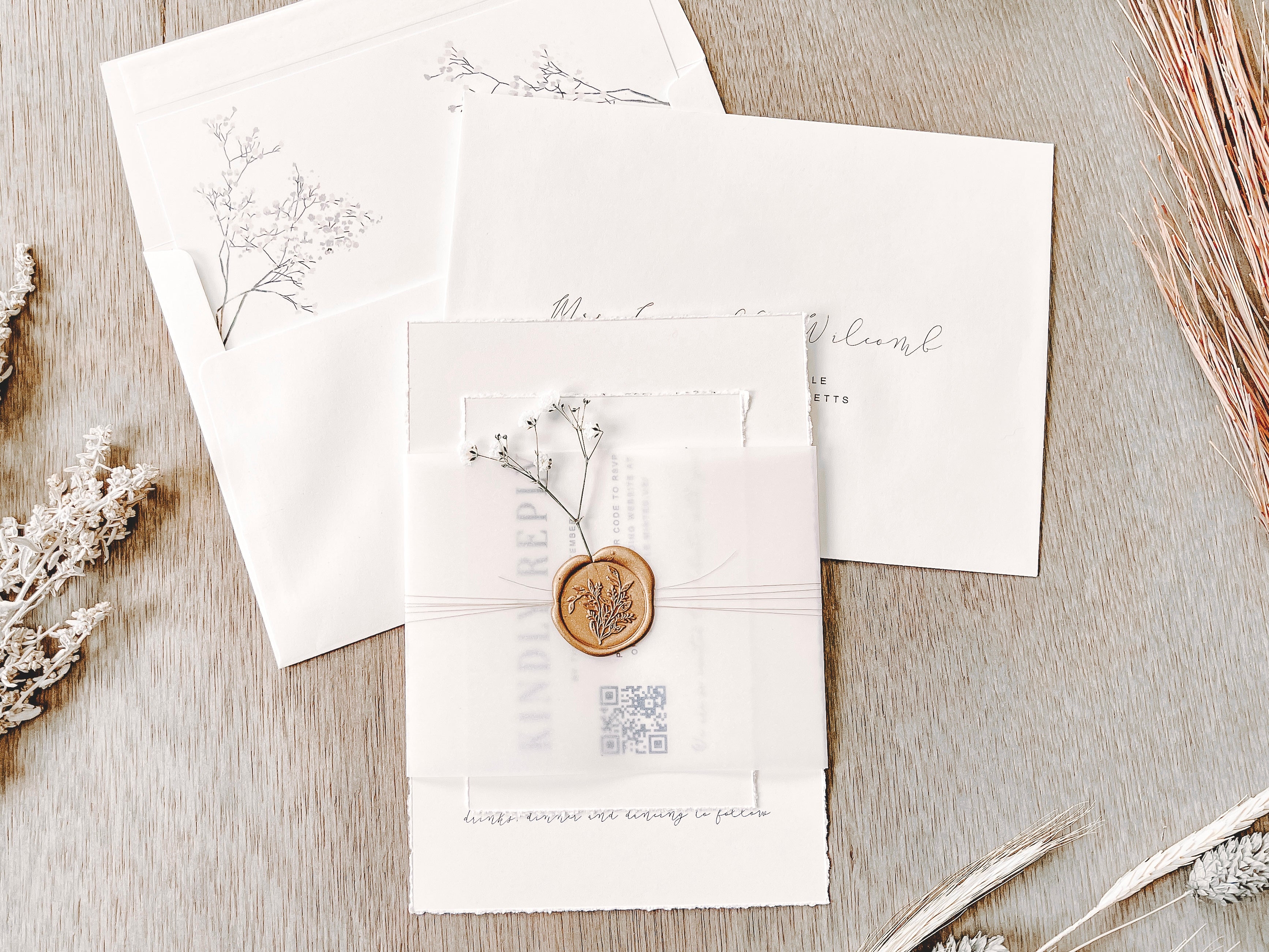 Contemporary Ivory Wedding Invitation with Baby’s Breath, Deckled Edging, Vellum Belly Band and Wax Seal