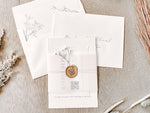 Contemporary Ivory Wedding Invitation with Baby’s Breath, Deckled Edging, Vellum Belly Band and Wax Seal