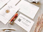 Contemporary Ivory Wedding Invitation with Baby’s Breath, Deckled Edging, Vellum Belly Band and Wax Seal