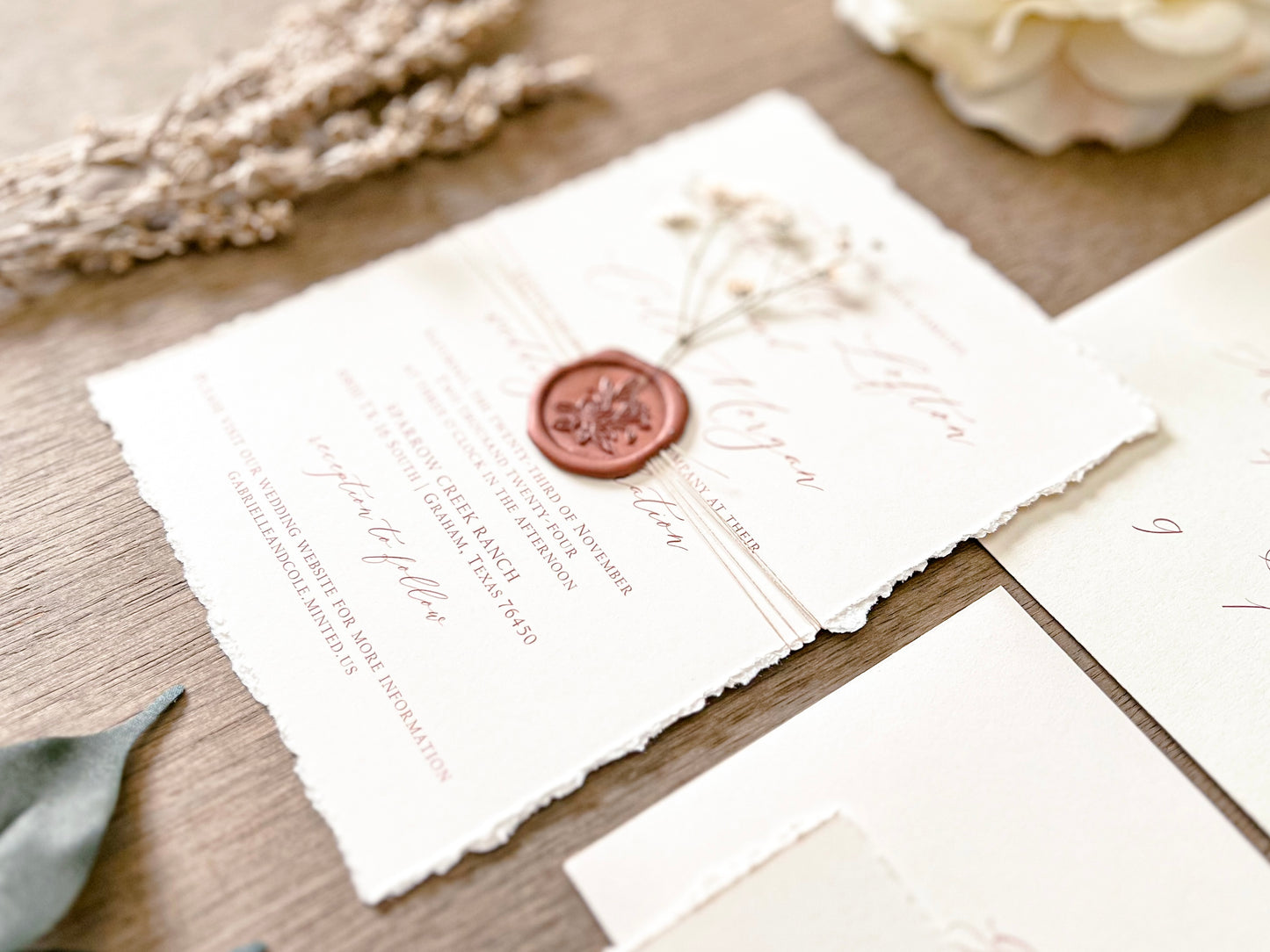 Ivory Baby’s Breath Wedding Invitation with Deckled Edging, Khaki Thread and Copper Wax Seal